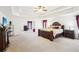 A large, open primary bedroom featuring tray ceilings and large windows at 248 Allegrini Dr, Atlanta, GA 30349