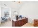 Office space with a large desk and windows at 248 Allegrini Dr, Atlanta, GA 30349