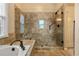 Contemporary bathroom with a large shower including a rainfall shower head and seating at 12015 Wildwood Springs Dr, Roswell, GA 30075