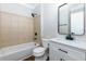 Bathroom featuring a vanity with a countertop sink, toilet, and a shower-tub combo at 608 Chickory Ct, Woodstock, GA 30188