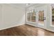 Bonus room featuring hardwood floors, neutral walls, and great natural light at 608 Chickory Ct, Woodstock, GA 30188