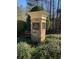 Stone pillar displaying the 'Nature Trail' community sign, surrounded by landscaped greenery at 608 Chickory Ct, Woodstock, GA 30188