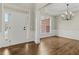 Bright foyer with hardwood floors, fresh paint, and elegant decorative trim at 608 Chickory Ct, Woodstock, GA 30188