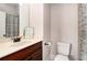 Classic bathroom features a dark wood vanity and a shower curtain at 2447 Gatebury Cir, Chamblee, GA 30341