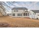 Large backyard with a screened-in porch perfect for outdoor relaxation and entertaining at 5195 Belmore Manor Ct, Suwanee, GA 30024