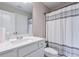 This bathroom features a toilet, shower curtain, and a marble vanity at 58 Cherry St, Lawrenceville, GA 30046