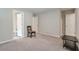 This bedroom features neutral walls, carpet floors, and a chair and table at 58 Cherry St, Lawrenceville, GA 30046