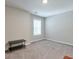 This bedroom features neutral walls, carpet floors and a table at 58 Cherry St, Lawrenceville, GA 30046