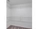 A walk in closet with white wire shelves and gray carpet at 58 Cherry St, Lawrenceville, GA 30046