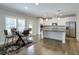 Bright, open kitchen with white cabinets, stainless appliances, and a center island with a dark countertop at 58 Cherry St, Lawrenceville, GA 30046