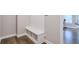 Welcoming mudroom featuring built-in bench and storage for shoes and coats, with hardwood flooring at 58 Cherry St, Lawrenceville, GA 30046