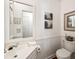 Bright bathroom with a large mirror, artistic decor, and classic white fixtures at 104 Terrace Dr # 6, Atlanta, GA 30305