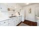 Well-lit kitchen showcasing white cabinetry, modern appliances, and a double sink with stylish fixtures at 104 Terrace Dr # 6, Atlanta, GA 30305