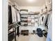 Organized walk-in closet featuring ample shelving and hanging space for clothing and accessories at 104 Terrace Dr # 6, Atlanta, GA 30305