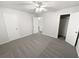 Bedroom featuring carpet, ceiling fan and closet at 1487 Arnold Dr, Lawrenceville, GA 30043