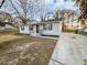 Charming single-story home with a manicured front yard, complemented by black shutters at 1487 Arnold Dr, Lawrenceville, GA 30043