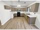 Well-lit kitchen with ample cabinetry, modern appliances, and sleek countertops, ideal for cooking and entertaining at 1487 Arnold Dr, Lawrenceville, GA 30043