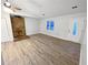 Cozy living room featuring hardwood floors, stone fireplace and decorative glass front door at 1487 Arnold Dr, Lawrenceville, GA 30043