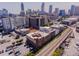 Wide aerial view of the brick building showing the train tracks, nearby roads, and city skyline at 342 Marietta Nw St # 8, Atlanta, GA 30313