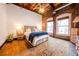 Charming bedroom with exposed brick, rustic wood floors, and warm lighting at 342 Marietta Nw St # 8, Atlanta, GA 30313