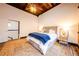 Bright bedroom with exposed rafters, rustic floors and access to en suite bath at 342 Marietta Nw St # 8, Atlanta, GA 30313