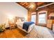 Inviting bedroom with exposed brick and rustic wood accents, creating a cozy atmosphere at 342 Marietta Nw St # 8, Atlanta, GA 30313