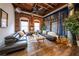 Bright living room featuring exposed brick, rustic wood floors, and stylish decor at 342 Marietta Nw St # 8, Atlanta, GA 30313