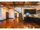 Open living area features stairs, hardwood floors, and black kitchen cabinets at 342 Marietta Nw St # 8, Atlanta, GA 30313