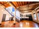 Open living space with hardwood floors, exposed ductwork, staircase, and modern kitchen at 342 Marietta Nw St # 8, Atlanta, GA 30313