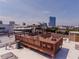 Wooden rooftop patio with chairs and tables, offering city views at 342 Marietta Nw St # 8, Atlanta, GA 30313