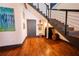 Modern staircase with black metal railings and wood stairs leading to the upper level at 342 Marietta Nw St # 8, Atlanta, GA 30313