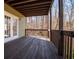 Spacious outdoor deck with wood flooring, railing, and an adjacent door to the house at 3595 Mason Ridge Dr, Winston, GA 30187