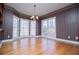 Dining area with a charming chandelier, round table with seating, and a set of large bay windows at 3595 Mason Ridge Dr, Winston, GA 30187