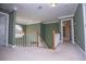 Bright hallway with a chandelier, white trim, and views to other rooms at 3595 Mason Ridge Dr, Winston, GA 30187