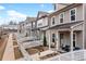 Charming townhome exteriors with picket fences and inviting front porches at 613 Everett Ln, Woodstock, GA 30188