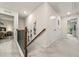 Upstairs hallway with carpeted floors, and a view of the bedroom at 613 Everett Ln, Woodstock, GA 30188