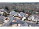 Aerial view of homes in a serene neighborhood with mature trees and access to a nearby river at 9135 Etching Overlook, Johns Creek, GA 30097