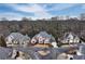 Aerial view of the charming homes nestled in a beautiful neighborhood surrounded by trees at 9135 Etching Overlook, Johns Creek, GA 30097