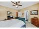 Cozy bedroom with ceiling fan, carpet, and traditional furnishings at 9135 Etching Overlook, Johns Creek, GA 30097