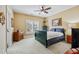 Comfortable bedroom with plush carpet, ceiling fan, and plantation shutters at 9135 Etching Overlook, Johns Creek, GA 30097