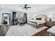 Main bedroom with seating area, elegant rug and view into dressing area at 9135 Etching Overlook, Johns Creek, GA 30097