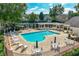 Relaxing community pool area with plenty of seating and umbrellas for a perfect day of leisure at 9135 Etching Overlook, Johns Creek, GA 30097