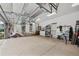 Spacious three car garage with an insulated door, built-in cabinets, and epoxy floors at 9135 Etching Overlook, Johns Creek, GA 30097