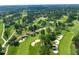 Aerial view of the golf course community, with rolling greens, sand traps, and mature trees at 9135 Etching Overlook, Johns Creek, GA 30097