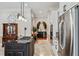 Modern kitchen featuring stainless steel appliances, a gas cooktop, and custom cabinetry at 9135 Etching Overlook, Johns Creek, GA 30097