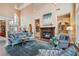 Elegant living room with a fireplace, tall windows, and an open layout at 9135 Etching Overlook, Johns Creek, GA 30097