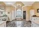 This main bathroom boasts a large tub, a separate shower, and gorgeous floors at 9135 Etching Overlook, Johns Creek, GA 30097