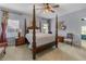 Serene main bedroom with a four-poster bed, soft lighting, and neutral decor at 9135 Etching Overlook, Johns Creek, GA 30097