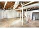 Unfinished basement with exposed beams, concrete floor, and potential for customization and storage at 2107 Seavey Dr, Decatur, GA 30032