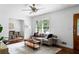 Well-lit living room with hardwood floors and an open view to the dining area through the doorway at 2107 Seavey Dr, Decatur, GA 30032